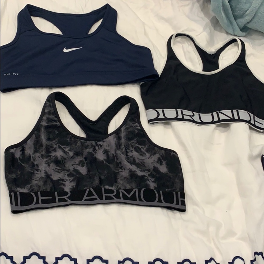 3 women’s Under Armour and Nike Sports bras